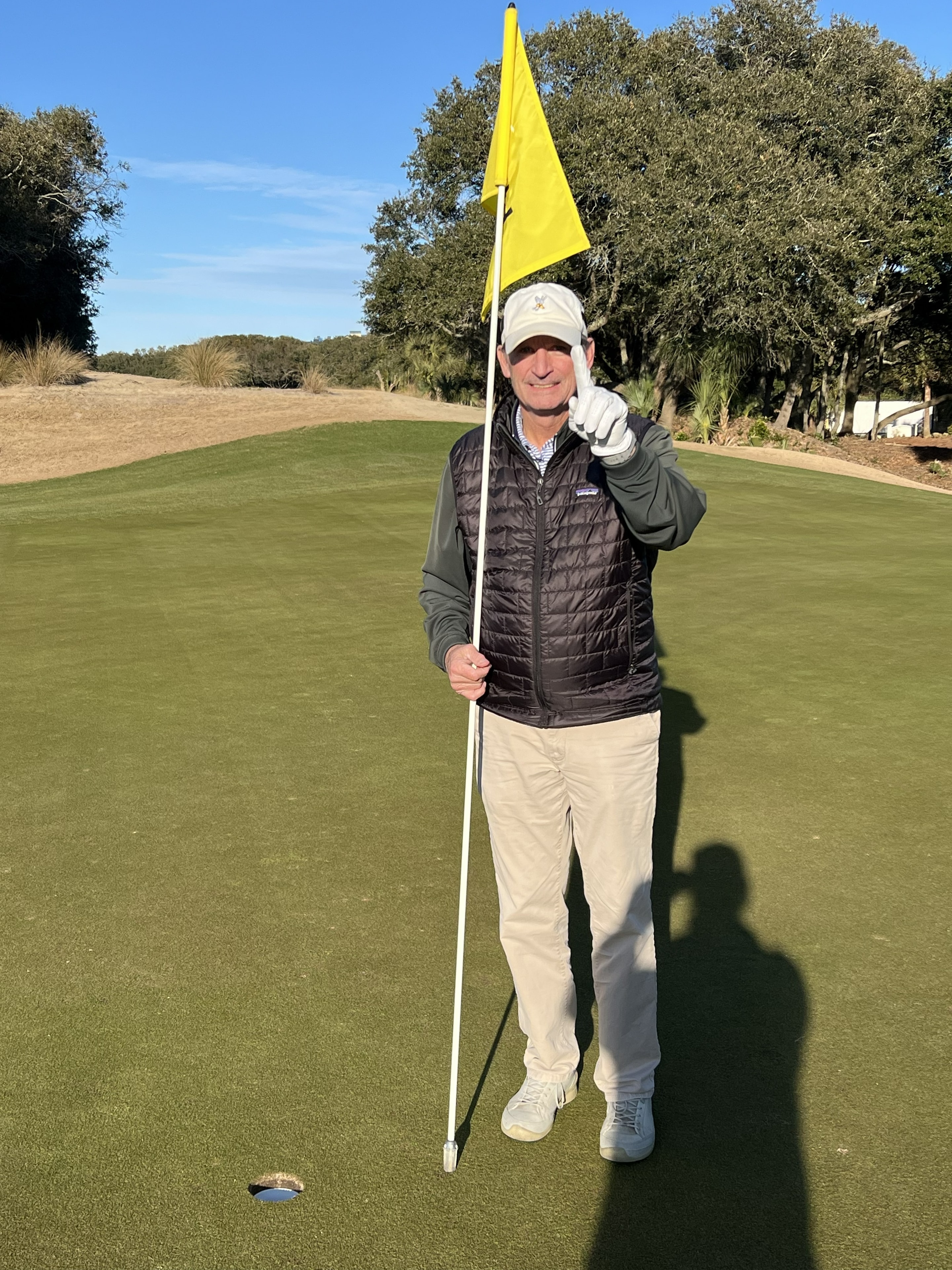 Craig Stillwagon celebrating his hole-in-one at Wild Dunes Links Hole 12