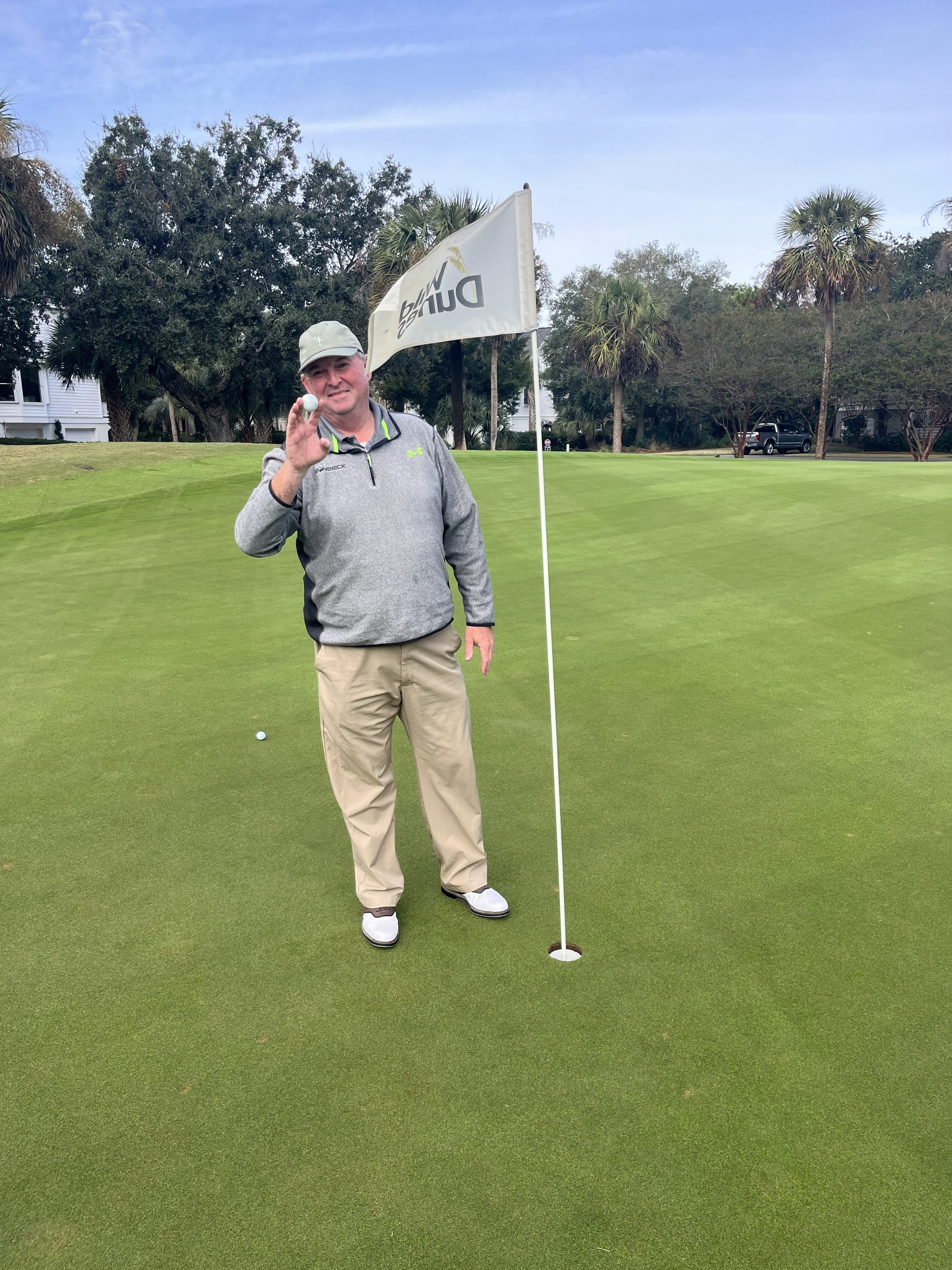 Greg O'Donnel celebrating his hole-in-one at Wild Dunes Links