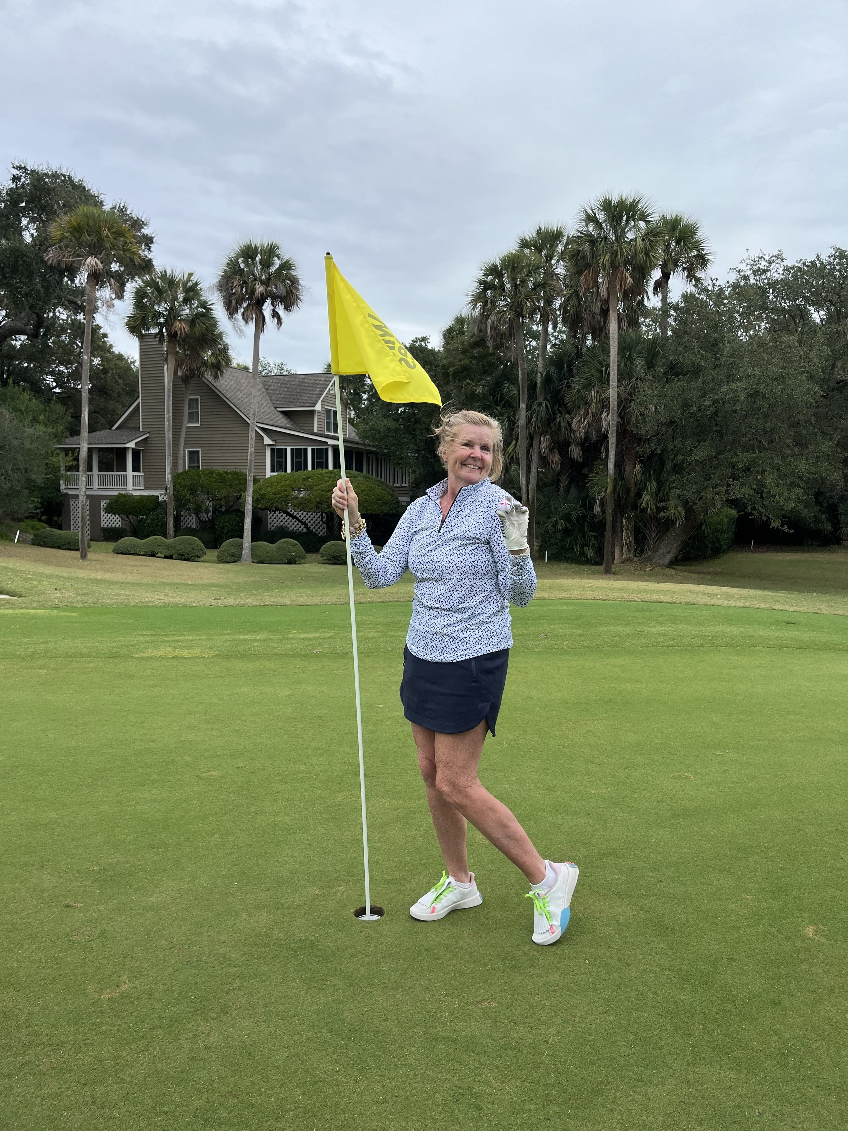 Kathy Stillwagon celebrating her two holes-in-one at Wild Dunes Links Hole 8