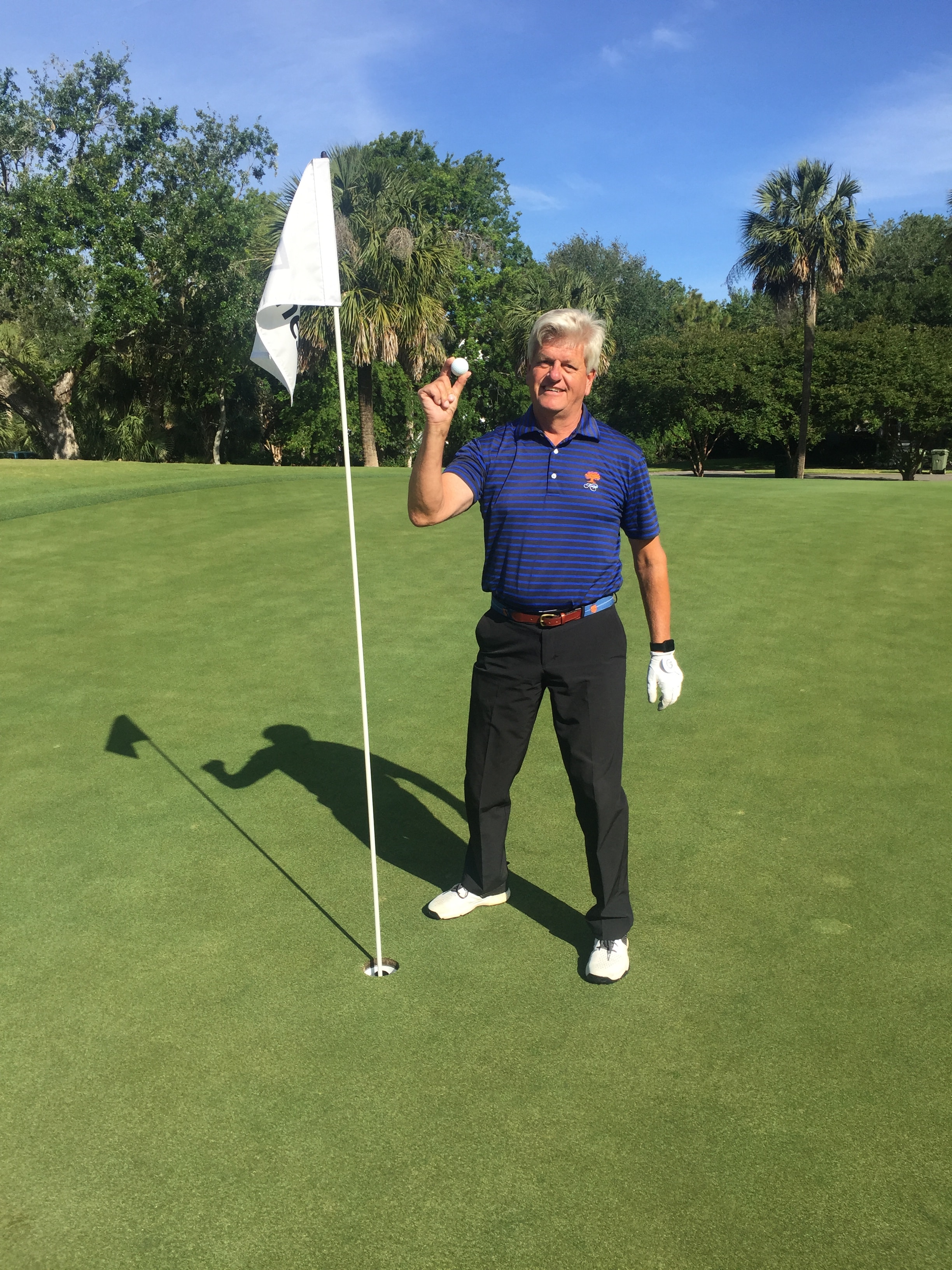 Mike Muzzy celebrating his hole-in-one at Wild Dunes