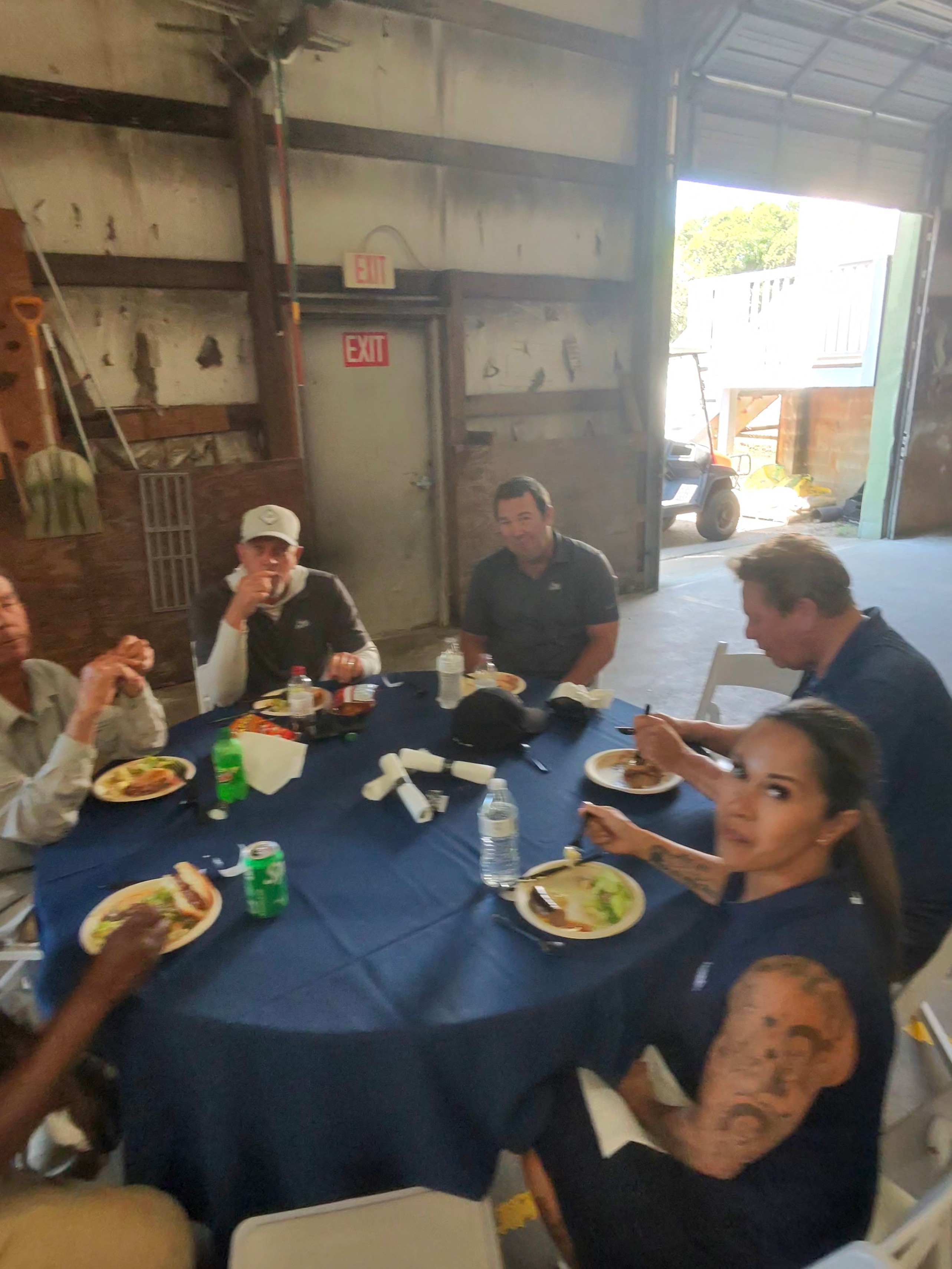 Wild Dunes members enjoying the appreciation lunch in the maintenance barn