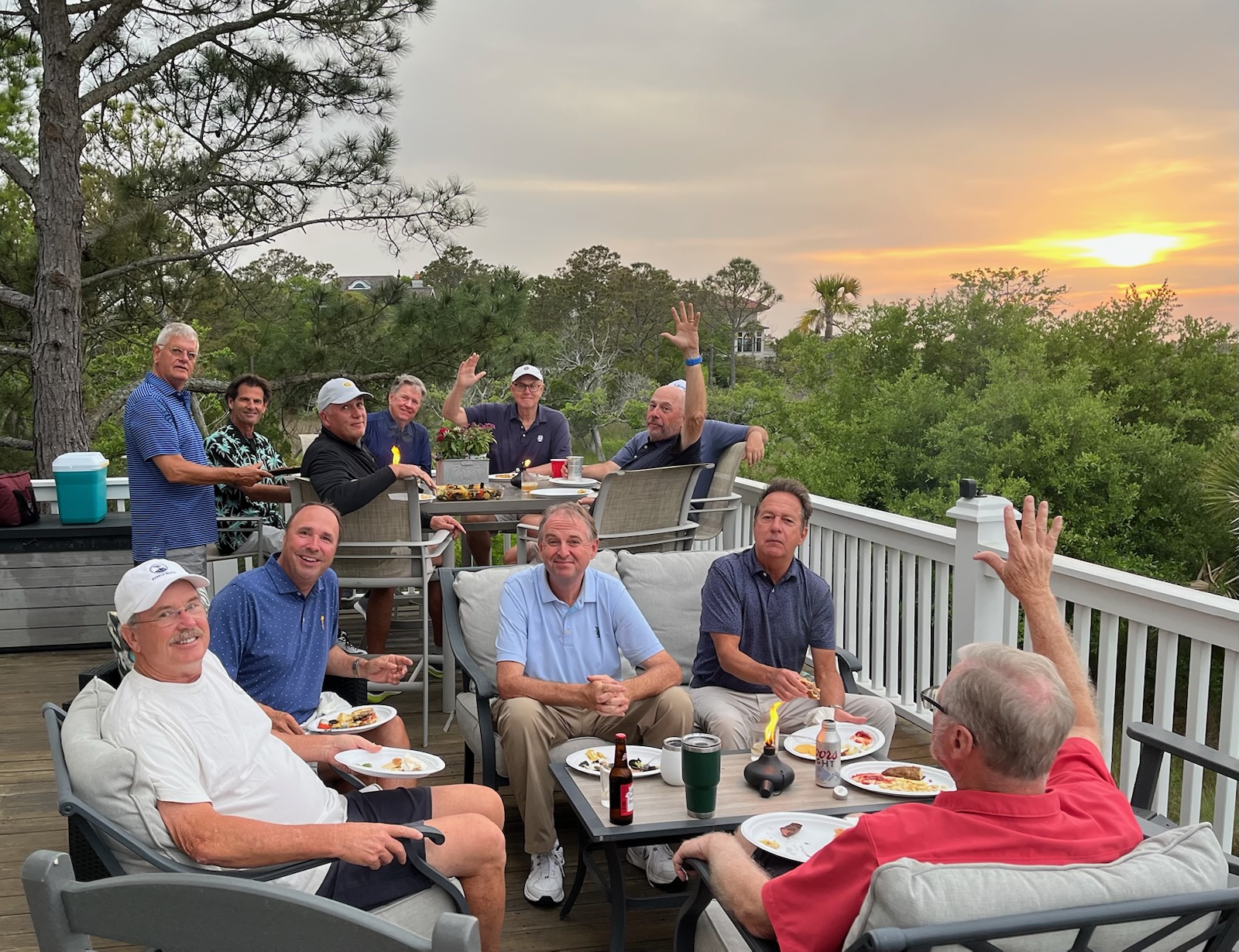 Wild Dunes members dining on the deck at sunset